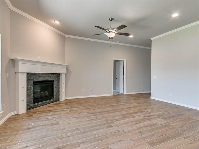 unfurnished living room featuring ceiling fan, crown molding, and light hardwood / wood-style flooring