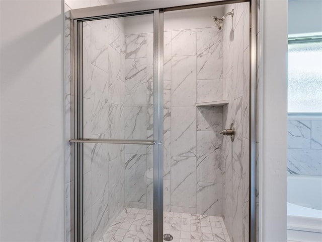 bathroom featuring an enclosed shower