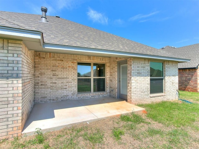 doorway to property with a patio area