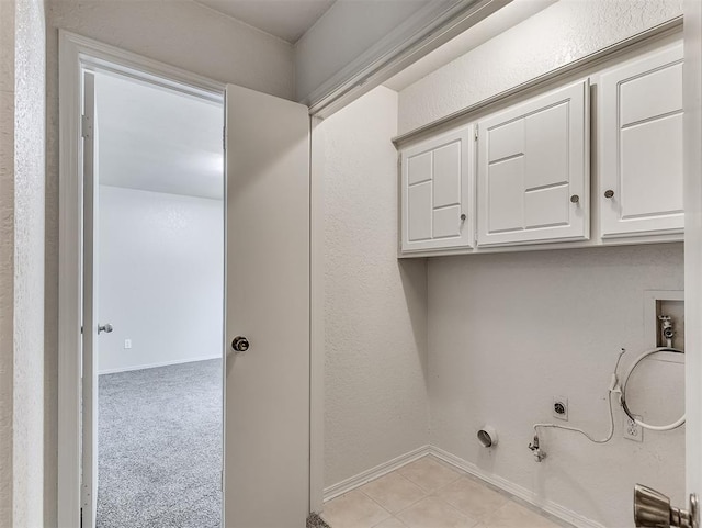 washroom with cabinets, washer hookup, light colored carpet, gas dryer hookup, and electric dryer hookup