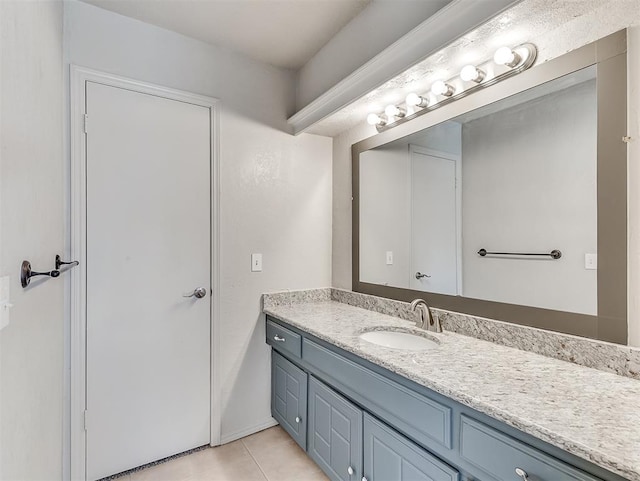 bathroom featuring tile patterned floors and vanity