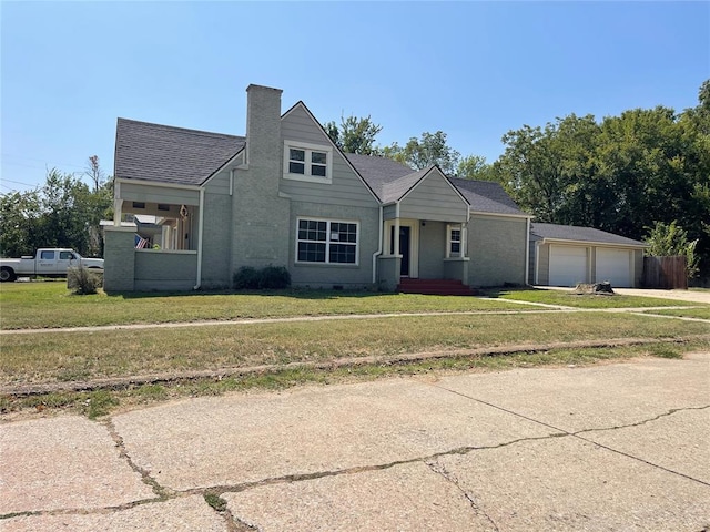 view of front facade with a front yard and a garage