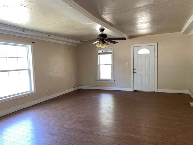 entryway with beam ceiling, ceiling fan, and dark wood-type flooring