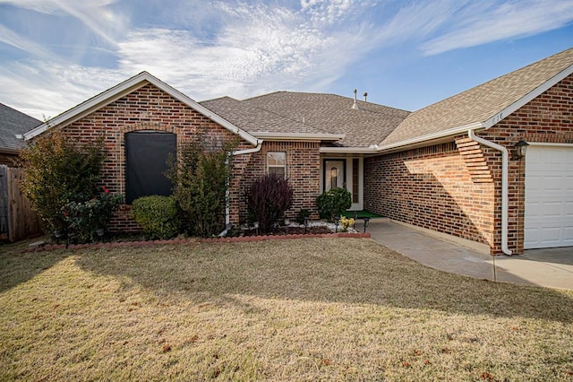 ranch-style home featuring a garage and a front yard