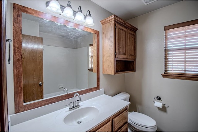 bathroom featuring vanity and toilet