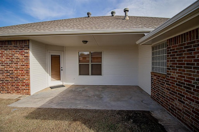 doorway to property with a patio