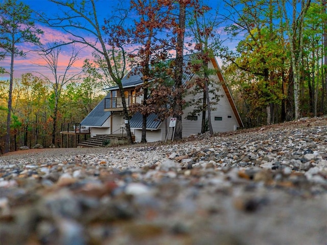 view of back house at dusk