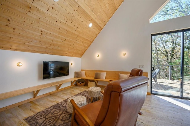 living room with light wood-type flooring, high vaulted ceiling, and wooden ceiling