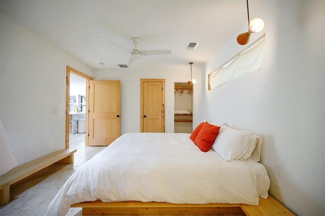 bedroom featuring ceiling fan and light wood-type flooring