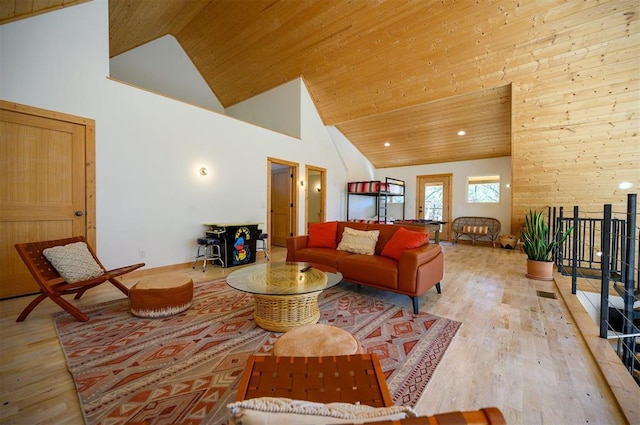 living room with light wood-type flooring, wood ceiling, and high vaulted ceiling