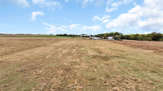 view of yard with a rural view