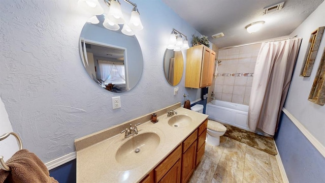 full bathroom featuring shower / tub combo, vanity, and toilet