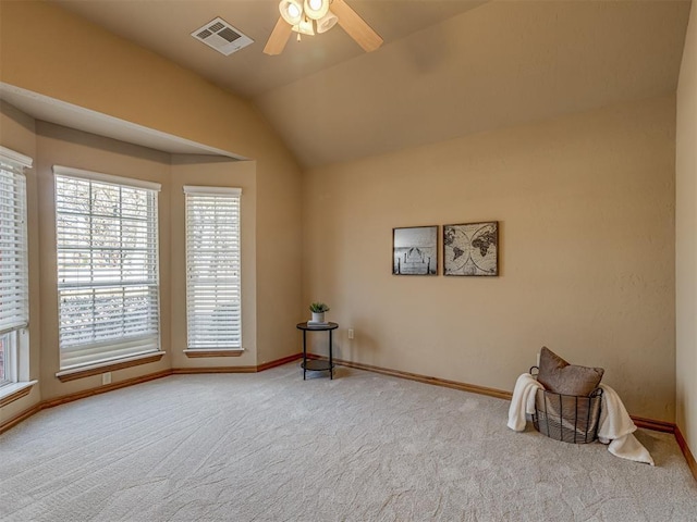 interior space with lofted ceiling and ceiling fan