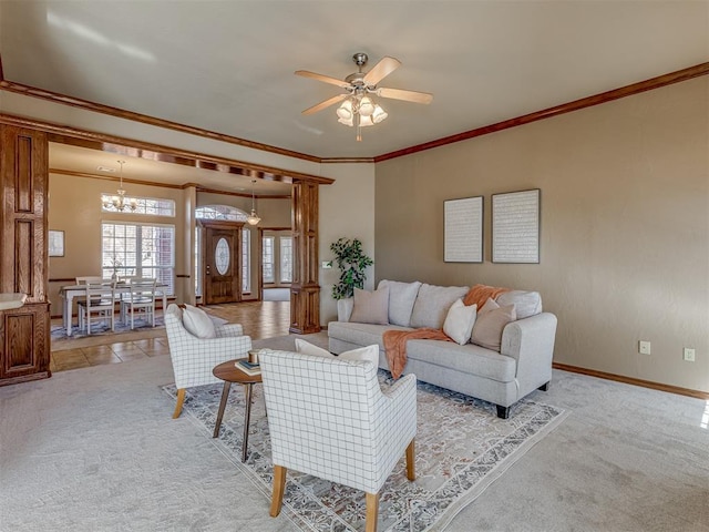 living room featuring ornamental molding, ceiling fan with notable chandelier, and light carpet