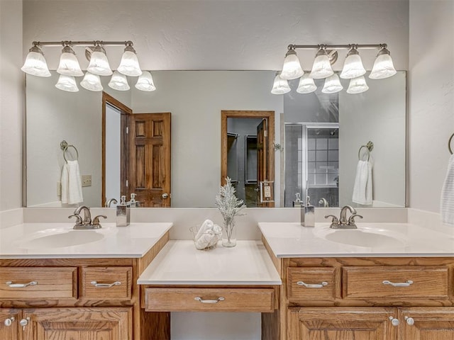 bathroom with vanity and a shower with door