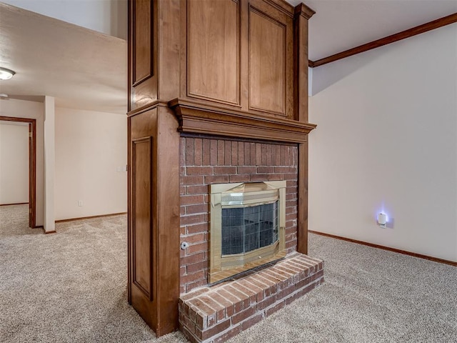 interior details with a brick fireplace, ornamental molding, and carpet flooring