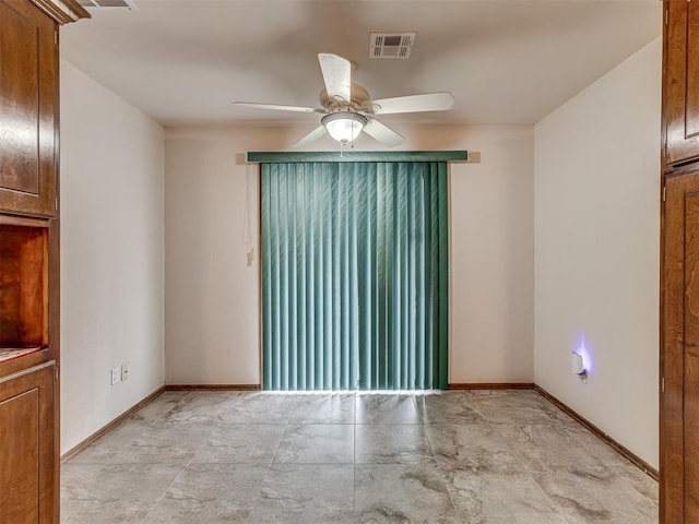 unfurnished room featuring ceiling fan