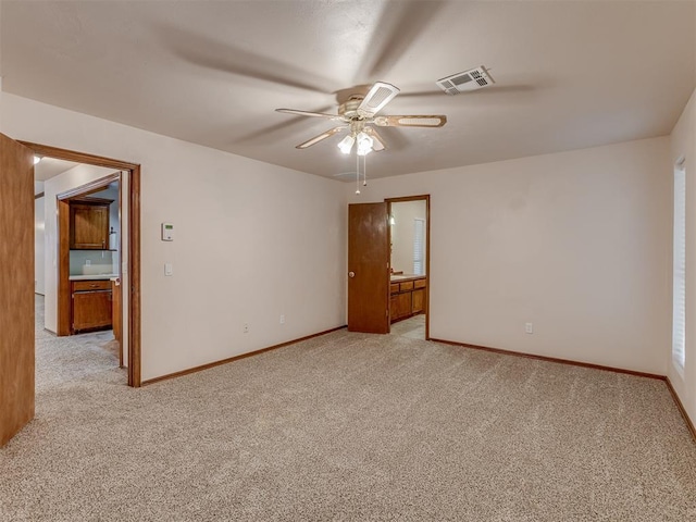 unfurnished bedroom featuring ceiling fan and light colored carpet