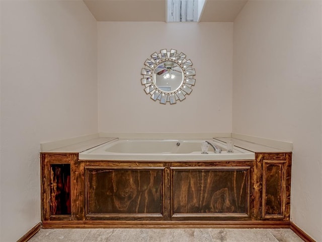 bathroom featuring a washtub