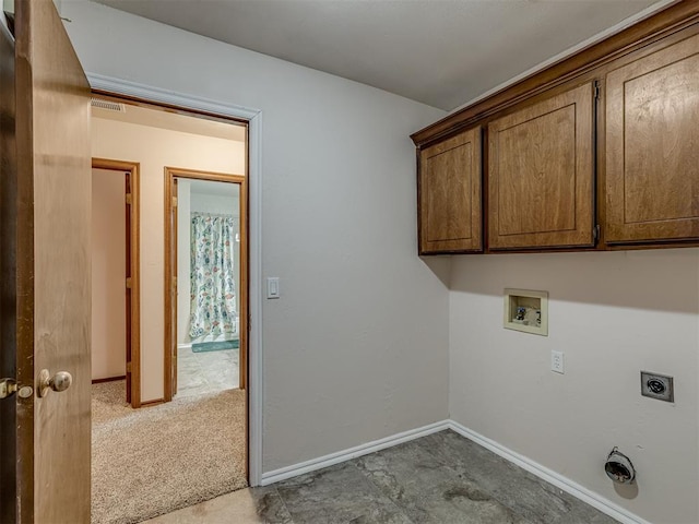 clothes washing area featuring electric dryer hookup, washer hookup, carpet floors, and cabinets