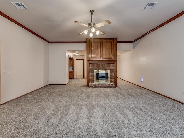 unfurnished living room with light carpet, a brick fireplace, crown molding, and ceiling fan