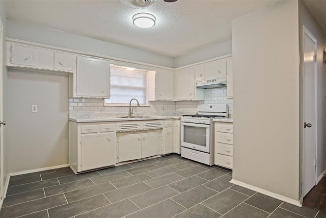 kitchen featuring white cabinetry, sink, white range oven, premium range hood, and decorative backsplash