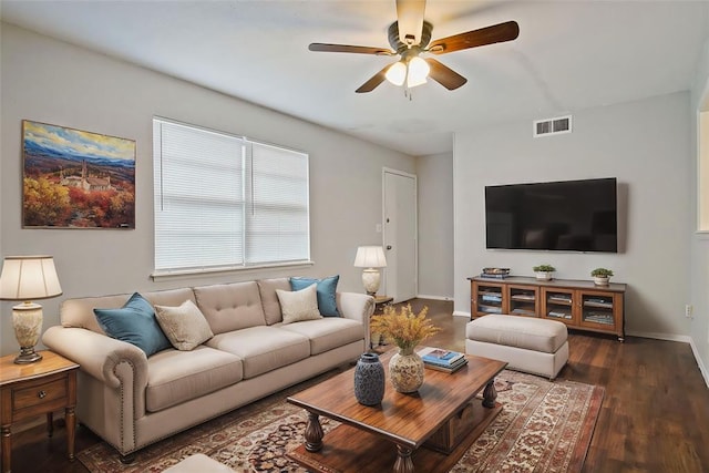 living room with ceiling fan and dark hardwood / wood-style flooring