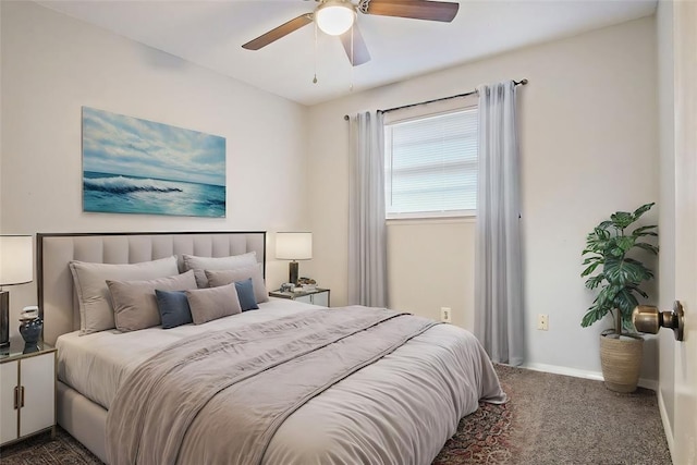 bedroom featuring dark colored carpet and ceiling fan