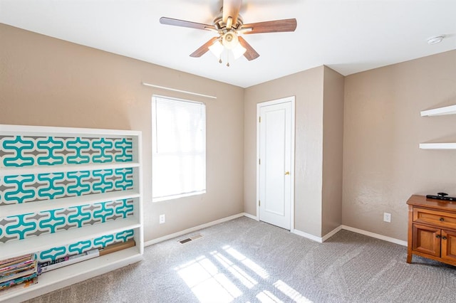 carpeted bedroom featuring ceiling fan