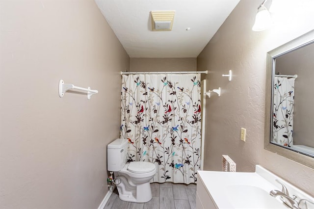 bathroom with a shower with shower curtain, vanity, toilet, and wood-type flooring