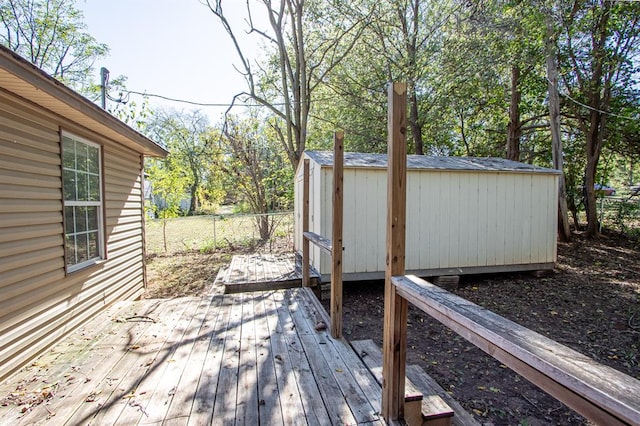 wooden terrace with a shed