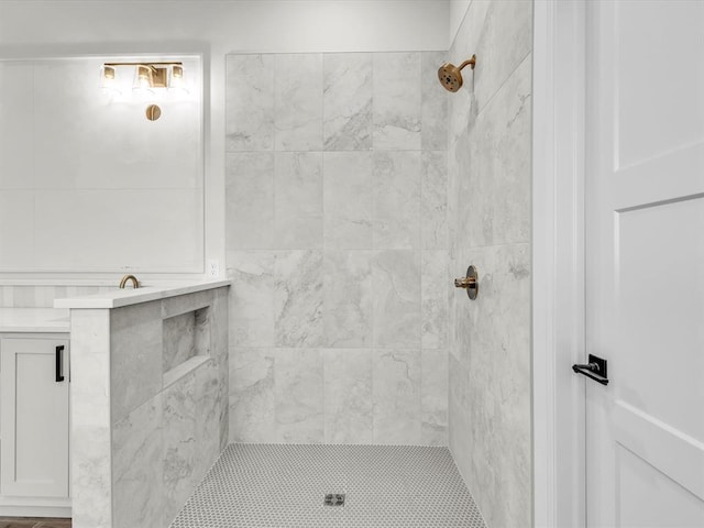 bathroom with a tile shower