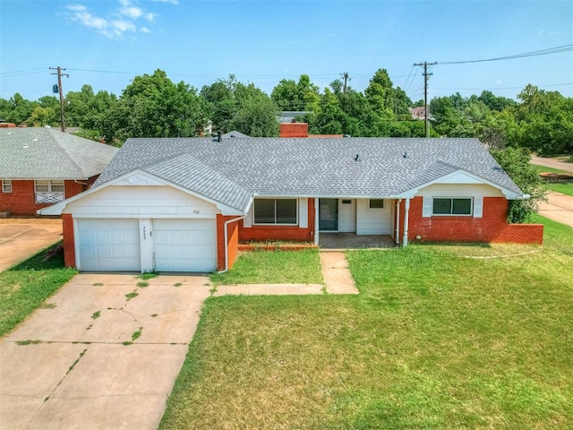 ranch-style house featuring a front lawn and a garage