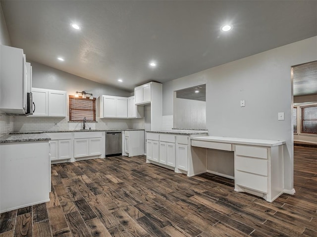 kitchen featuring dishwasher, dark wood-type flooring, white cabinetry, and lofted ceiling