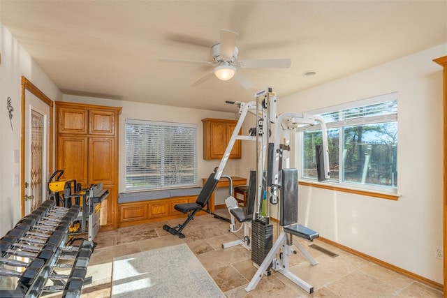 workout area featuring ceiling fan