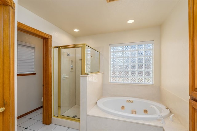 bathroom with tile patterned floors and separate shower and tub