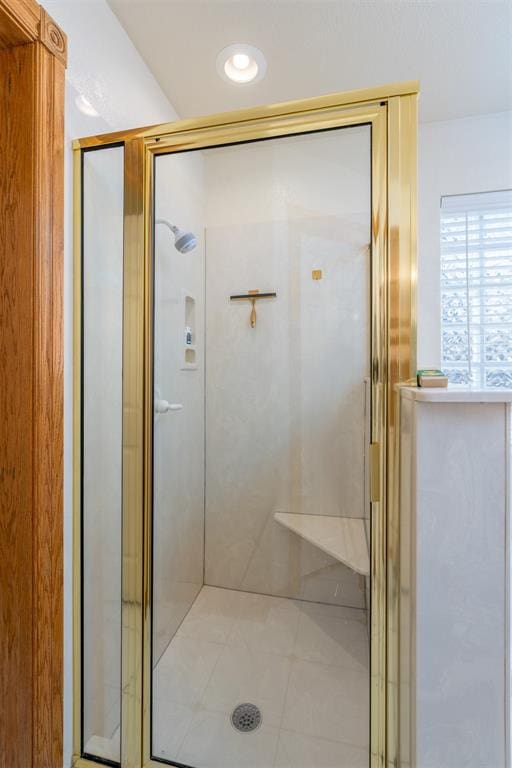 bathroom featuring an enclosed shower