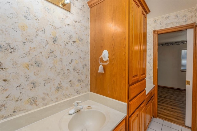 bathroom with tile patterned flooring and vanity