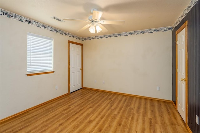 unfurnished bedroom featuring ceiling fan and light hardwood / wood-style floors