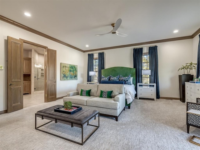 carpeted bedroom featuring ceiling fan, ensuite bathroom, and crown molding