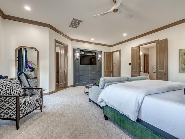 bedroom with light carpet, ensuite bathroom, ceiling fan, and crown molding