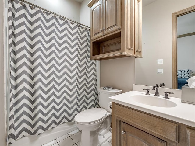 bathroom with tile patterned flooring, vanity, toilet, and walk in shower