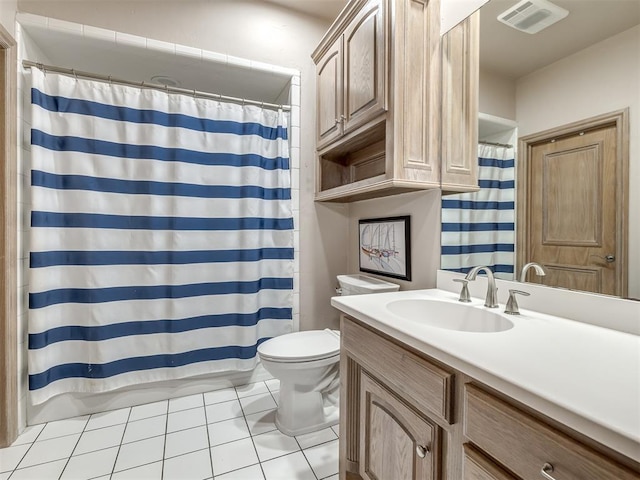 bathroom with tile patterned floors, vanity, curtained shower, and toilet