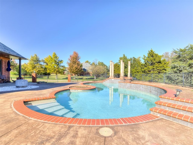 view of swimming pool with a patio area