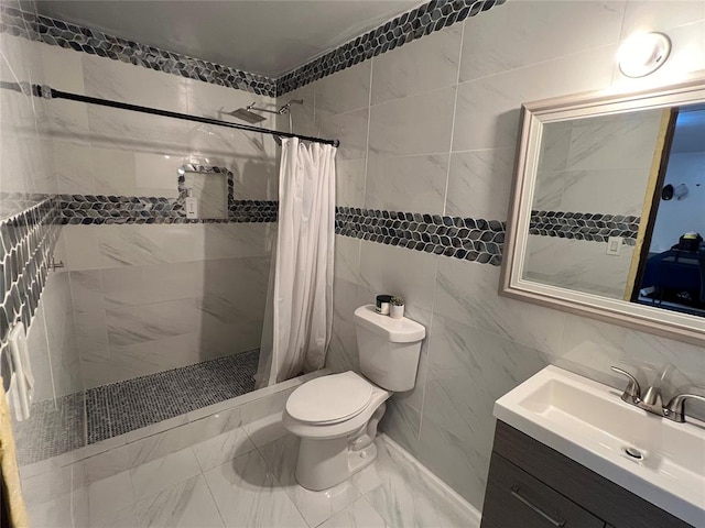 bathroom with toilet, vanity, tile walls, and a shower with shower curtain