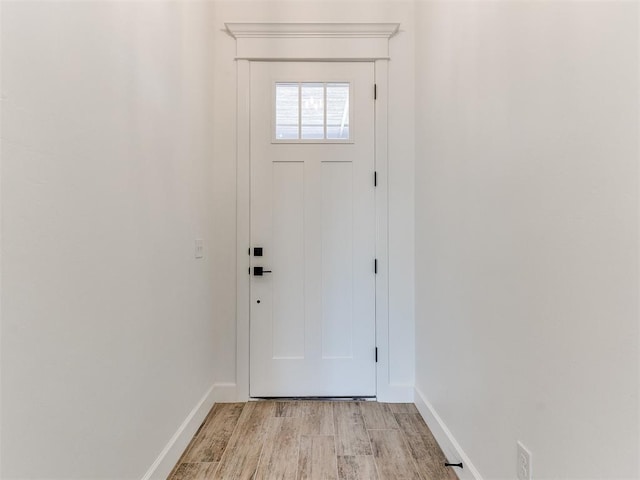 doorway with light wood-type flooring