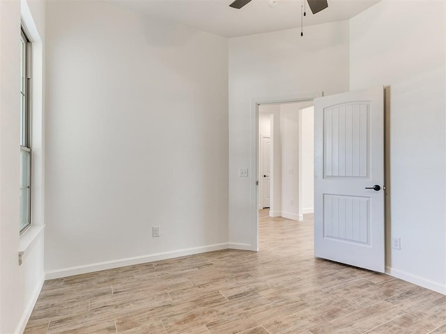 spare room with ceiling fan and light hardwood / wood-style floors