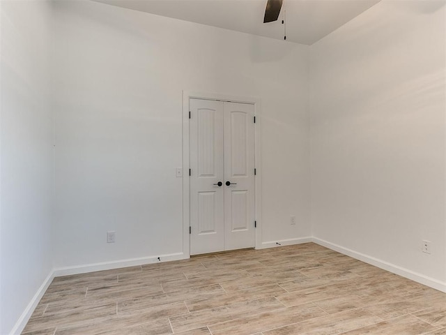 spare room with ceiling fan and light hardwood / wood-style floors