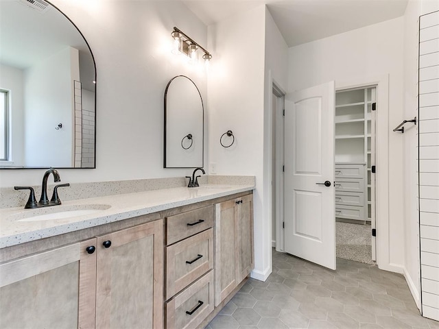 bathroom featuring tile patterned floors and vanity