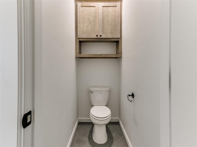 bathroom featuring tile patterned floors and toilet